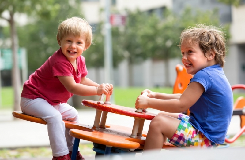 The children played in the garden. (happily)